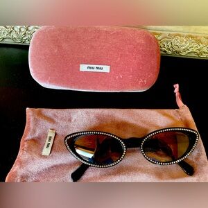 Miu miu Cat Eye rhinestone sunglasses. Barely used. Very cool sunglasses.